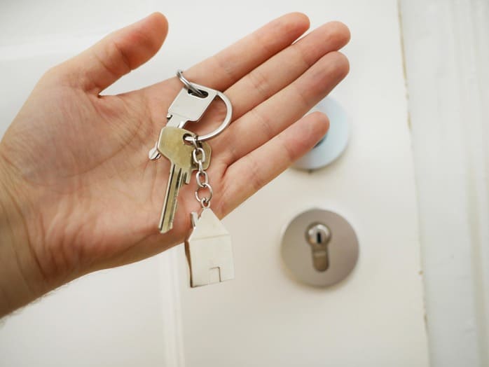 man-with-house-keys-after-finding-rental-property-loan 